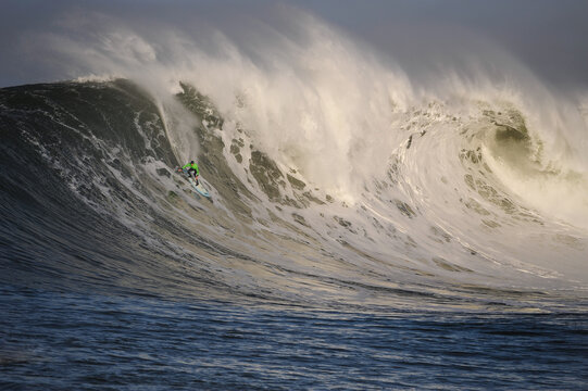 Man Surfing On Sea Wave