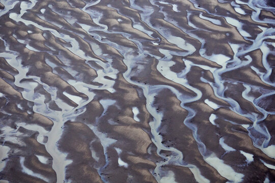 Channels of tide lines exposed at low tide along Cook Inlet