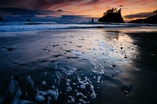Scenic view of Second Beach against cloudy sky during sunset