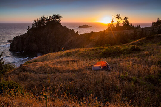 View Of Tent On Mountain During Sunset