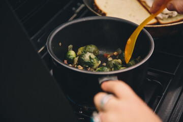 Close up of woman's hands preparing food