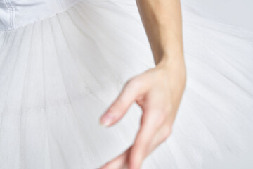 Ballerina in white tutu elegant dance performed sensuality silhouette light background