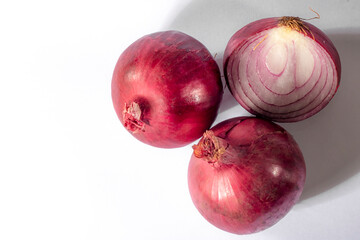 Red onions on white background in Brazil