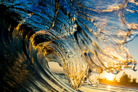Close up of wave curling during sunrise in North shore, Oahu, Hawaii