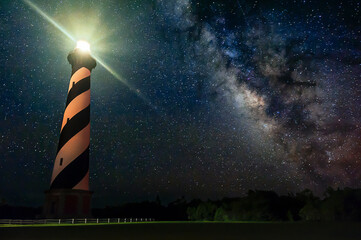 Low angle view of Cape Hatteras Lighthouse against milky way at night