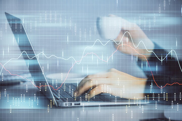 Double exposure of businesswoman hands typing on computer and forex graph hologram drawing. Financial analysis concept.