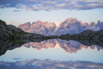 sunset at the black lake with the Brenta Dolomites in the background