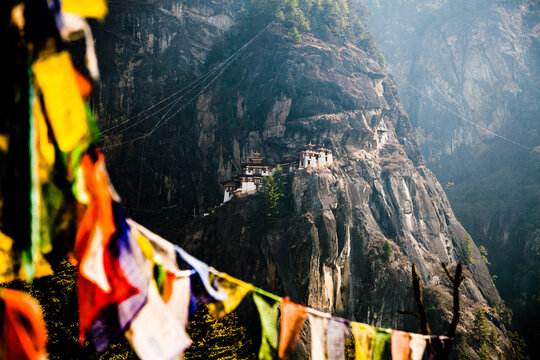 Paro Taktsang on mountain with prayer flags in foreground