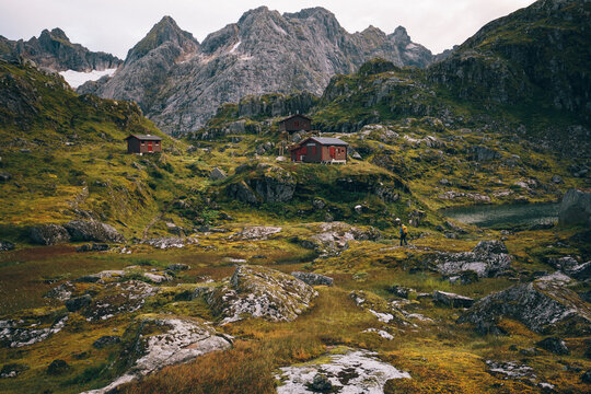 Scenic view of houses on landscape with mountain in background
