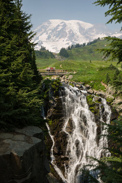 Tourist watching Myrtle Falls with Mount Rainier in background