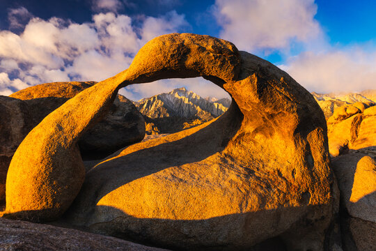 View of Mobius Arch with Mount Whitney in background during sunrise