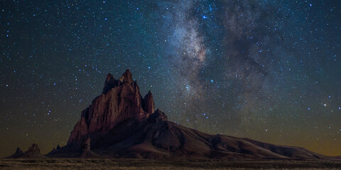 Scenic view of Shiprock mountain against starry sky at night