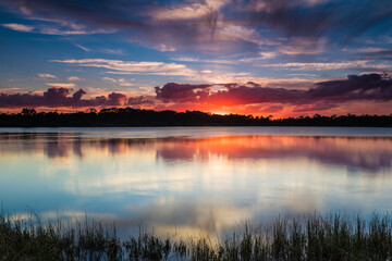 Scenic view of lake in George LeStrange Preserve during sunset