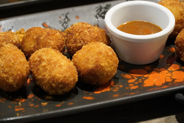croquettes with deep sweet sauce. traditional spanish food