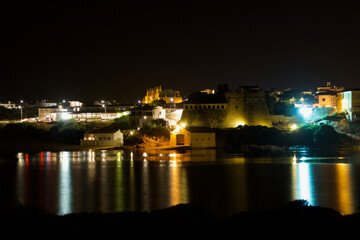 Night view of Vila Nova de Milfontes, Portugal, from the south bank to the north bank.