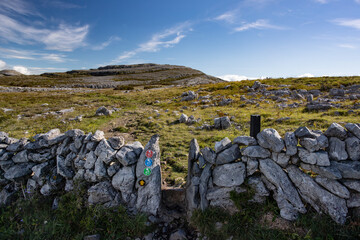 Walking trail path signs in the Burren national park, County Clare, Ireland