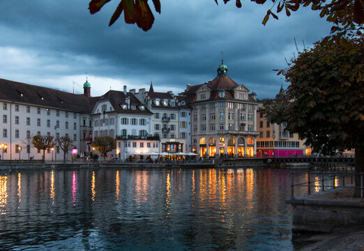Lucern skyline with lights reflecting in river at night