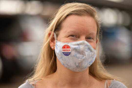 Portrait Of A Caucasian Woman Wearing A Pattern Mask And An I Voted Today Sticker On The Mask