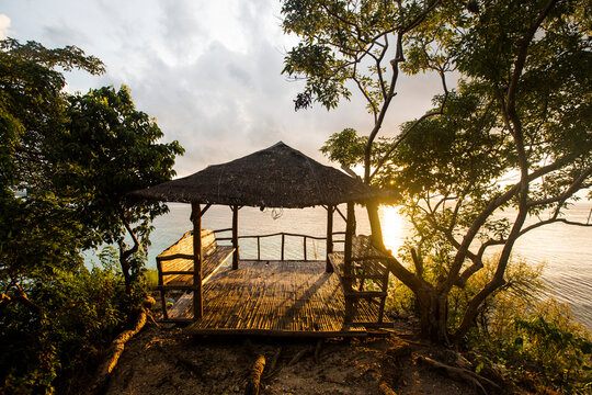 Bamboo hut on coast during sunrise