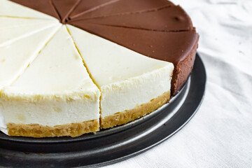 Chocolate cake cut into several pieces with decoration