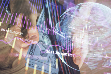 Multi exposure of forex graph drawing hologram and USA dollars bills and man hands. Technical Analysis concept.