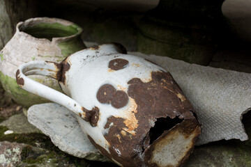old rusty metal white vase