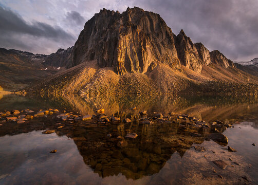 Reflection of mountain in Talus Lake during sunset