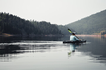 Man Kayak fishing in colorado
