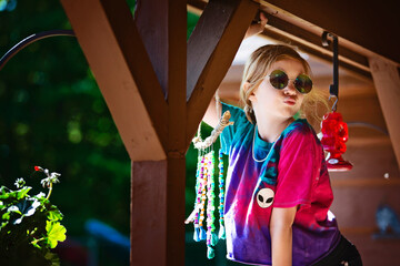 Young Red Haired Girl in Tie Dye shirt