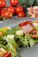 caesar salad on a gray plate with decor and copyspace