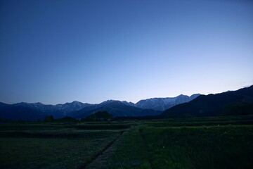 view of mountain silhouette on twilight sky after sunset, Japanese alps, Hakuba, Japan