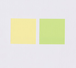 Colorful square note paper on white paper background.