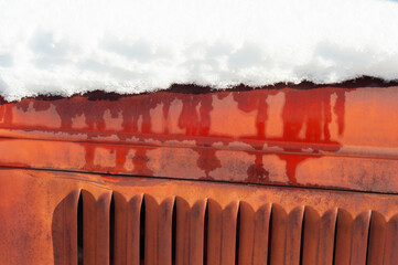 Snow on the hood of a vintage truck