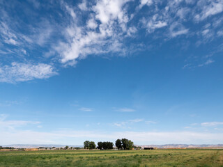 Low horizon landscape with summer sky and countryside in western Colorado