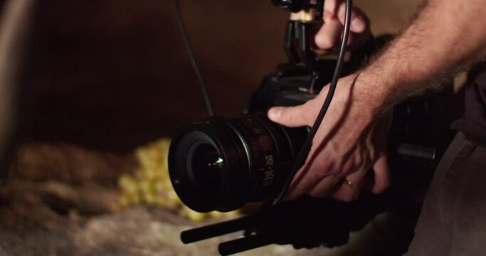 Caucasian adult male hands adjust glass lens of professional business new digital technology, blackmagic camera URSA Mini Pro camera equipment, ultimate high bandwidth recorder, static close up