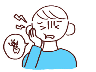 頬を抑える虫歯の若い男性