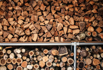 Woodpile in the countryside with various shapes and sized