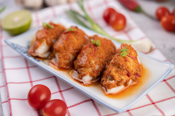 Chu che squid with spring onion, tomato, lemon and chili.