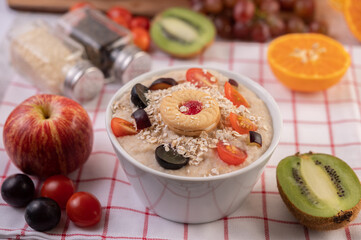 Dessert cup with apples, kiwi, orange, and grapes.