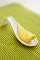 Fototapeta na wymiar slice of lemon on spoon