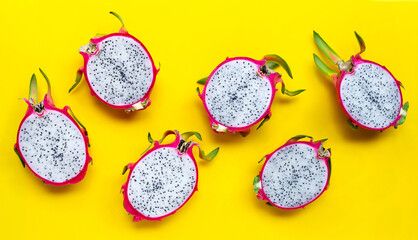 Ripe dragonfruit or pitahaya on yellow background.
