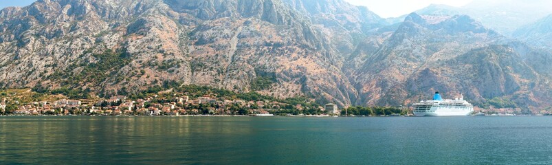 Panorama of Kotor Bay with a fragment of the ancient city of Kotor, Montenegro. A view of the mountains from the waters of the Bay of Kotor on the Adriatic Sea.
