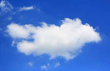 Naklejka na ściany i meble White fluffy cloud on blue sky background