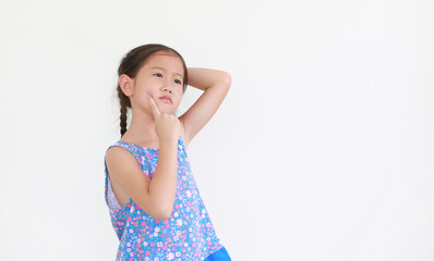 Portrait asian little kid girl thinking expression and pointing index finger on cheek with puzzled expression isolated on white background. Child looking up.