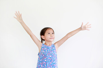 Asian little kid girl with pigtail hair standing and open wide arms with looking up isolated on white background.