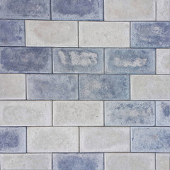 Background of the brickwork. Structural material. For designers. Interior of the building facade. Masonry. Construction industry. The color is gray. Square photo.