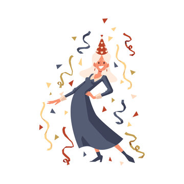 Happy old woman in party hat dancing with confetti