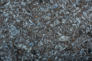 the texture of many flattened stones of various shapes and colors
