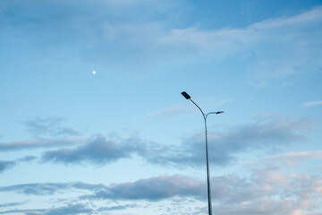Street lantern on sky background.A modern street LED lighting pole. Copy space