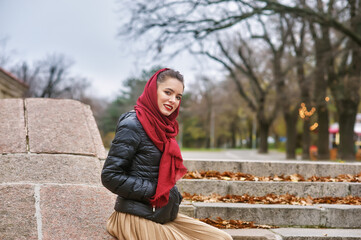 Fototapeta premium Young beautiful woman in autumn Park